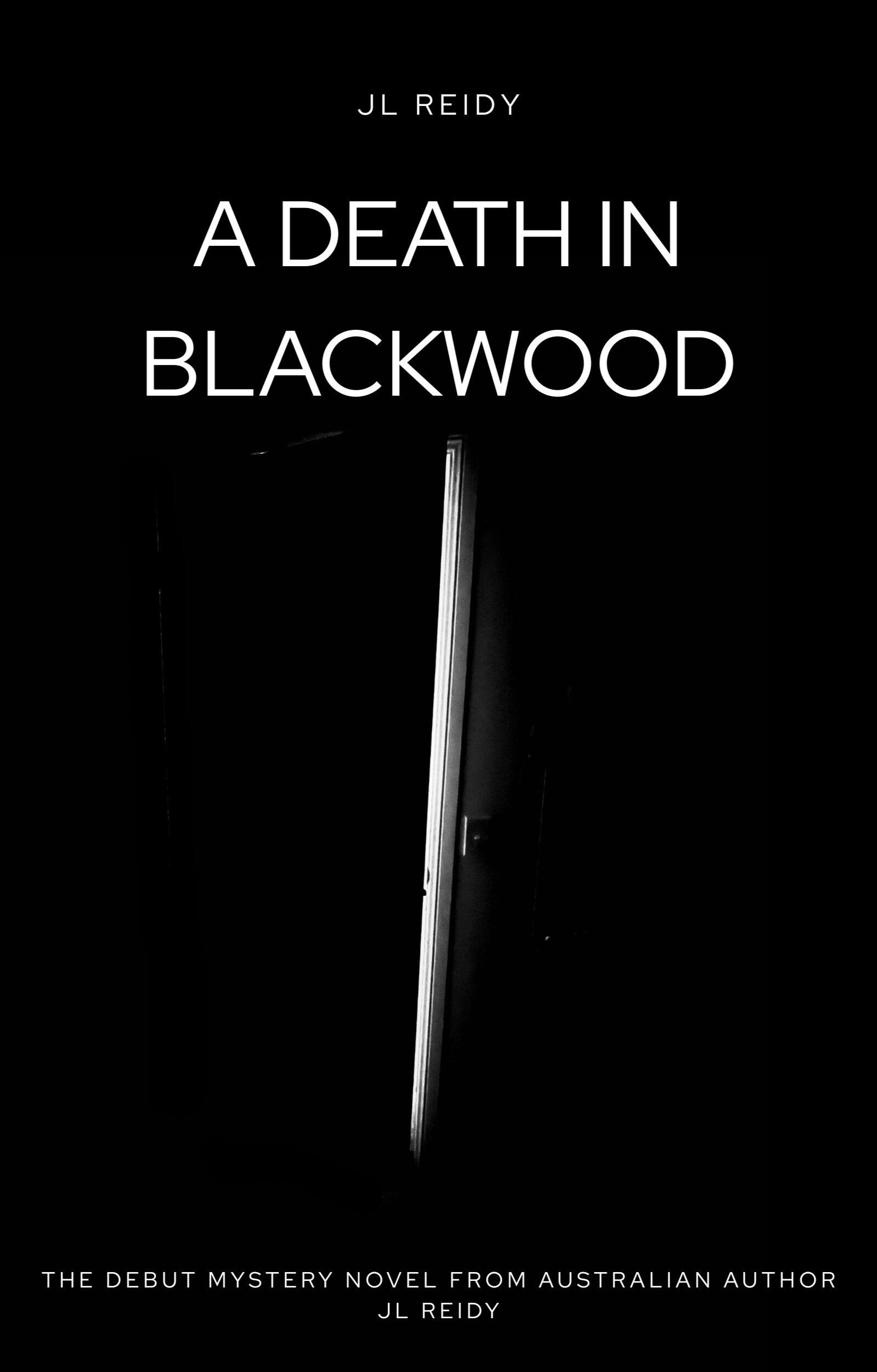 JL Reidy A Death in Blackwood bookcover. Mysterious black cover with a bright crack of light showing through a doorway